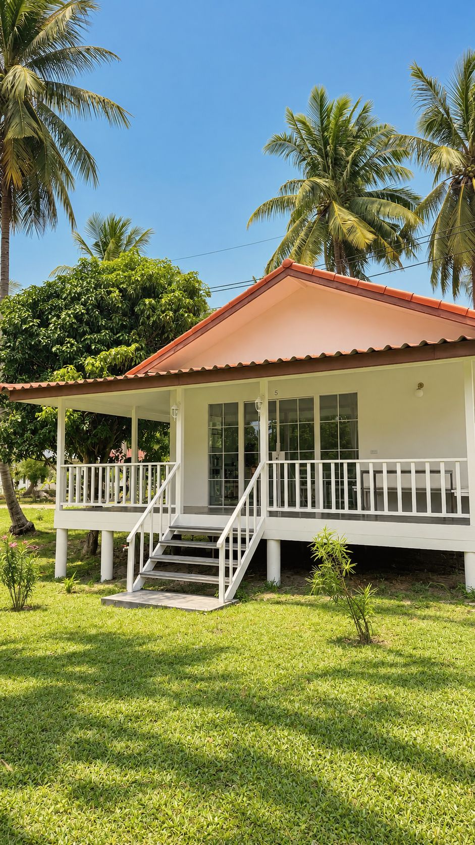 Bungalow framed by palms