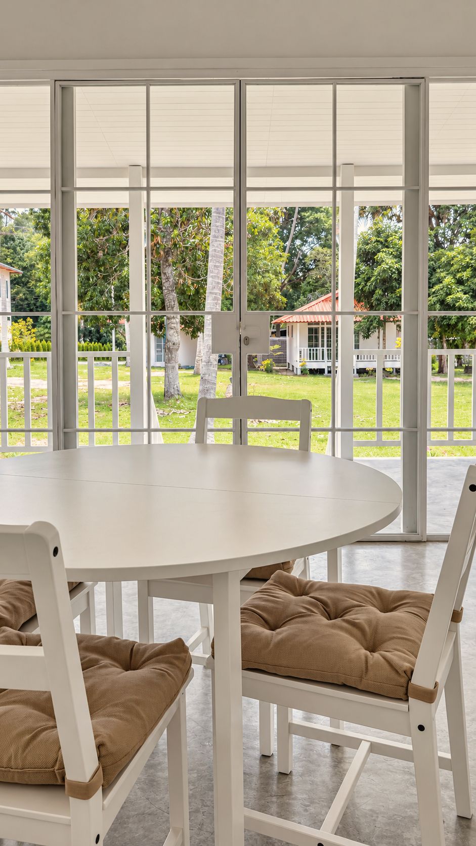 Dining table looking out to the veranda and garden