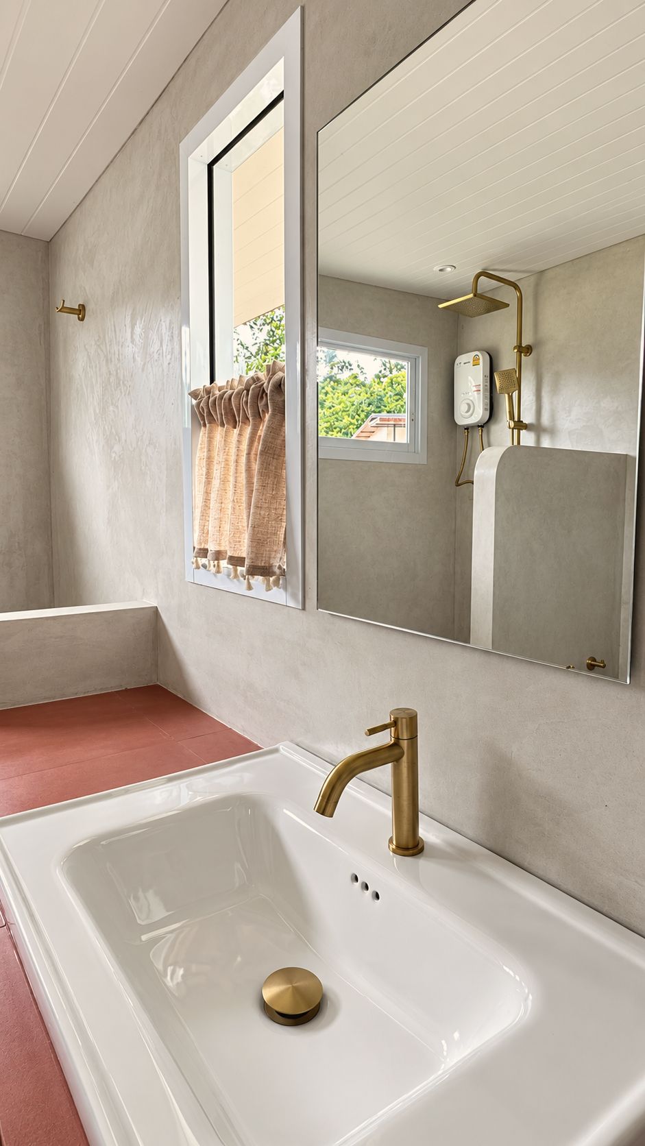 Basin with brushed brass tap