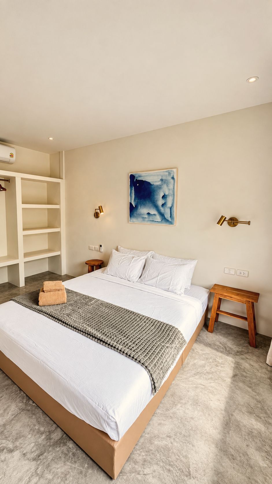 King-size bed with open wardrobe shelving