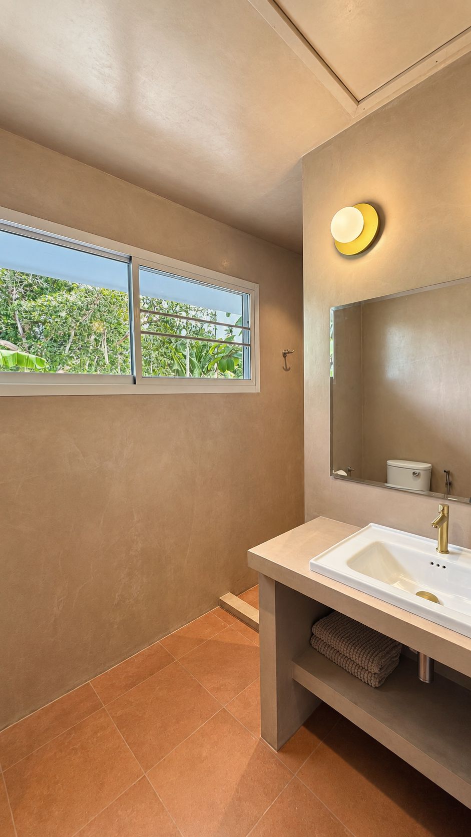 Bathroom vanity beneath a garden window